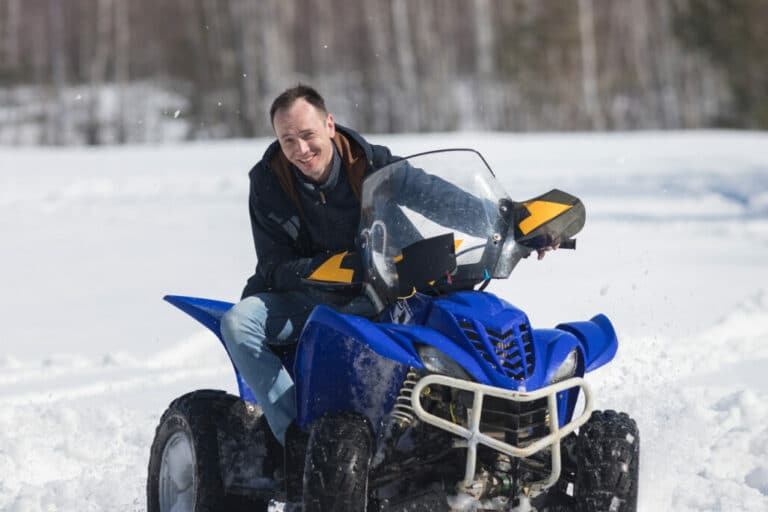 How should a snowmobile jacket fit